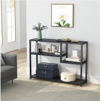 Консольний стіл у передпокої з полицями для зберігання
