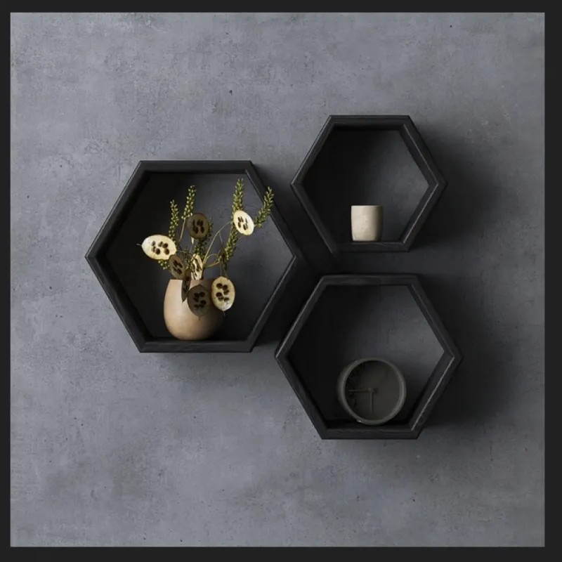 A set of three black hexagonal shelves