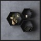 A set of three black hexagonal shelves