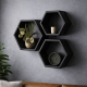 A set of three black hexagonal shelves